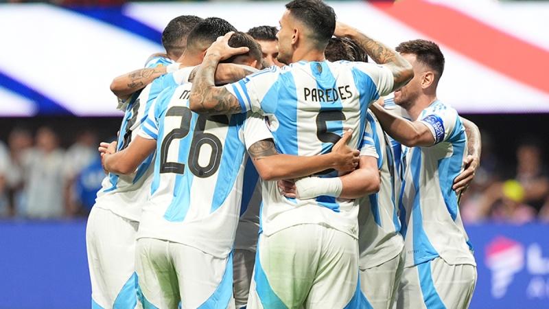 A group of men in sports uniforms hugging each other

Description automatically generated