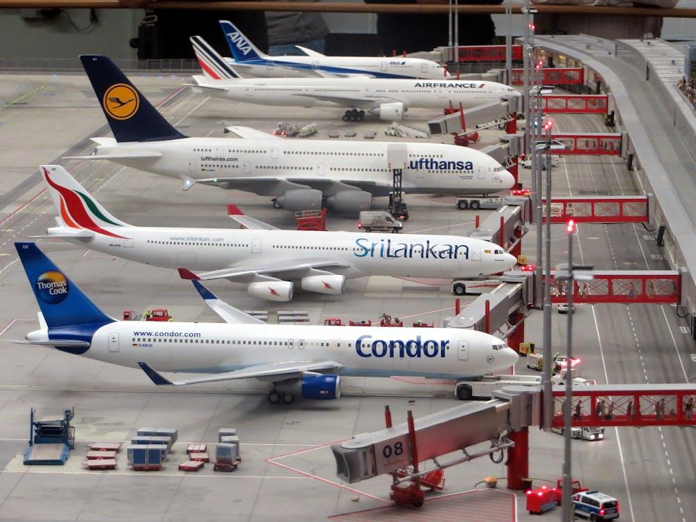 Free Condor Airplane on Grey Concrete Airport Stock Photo