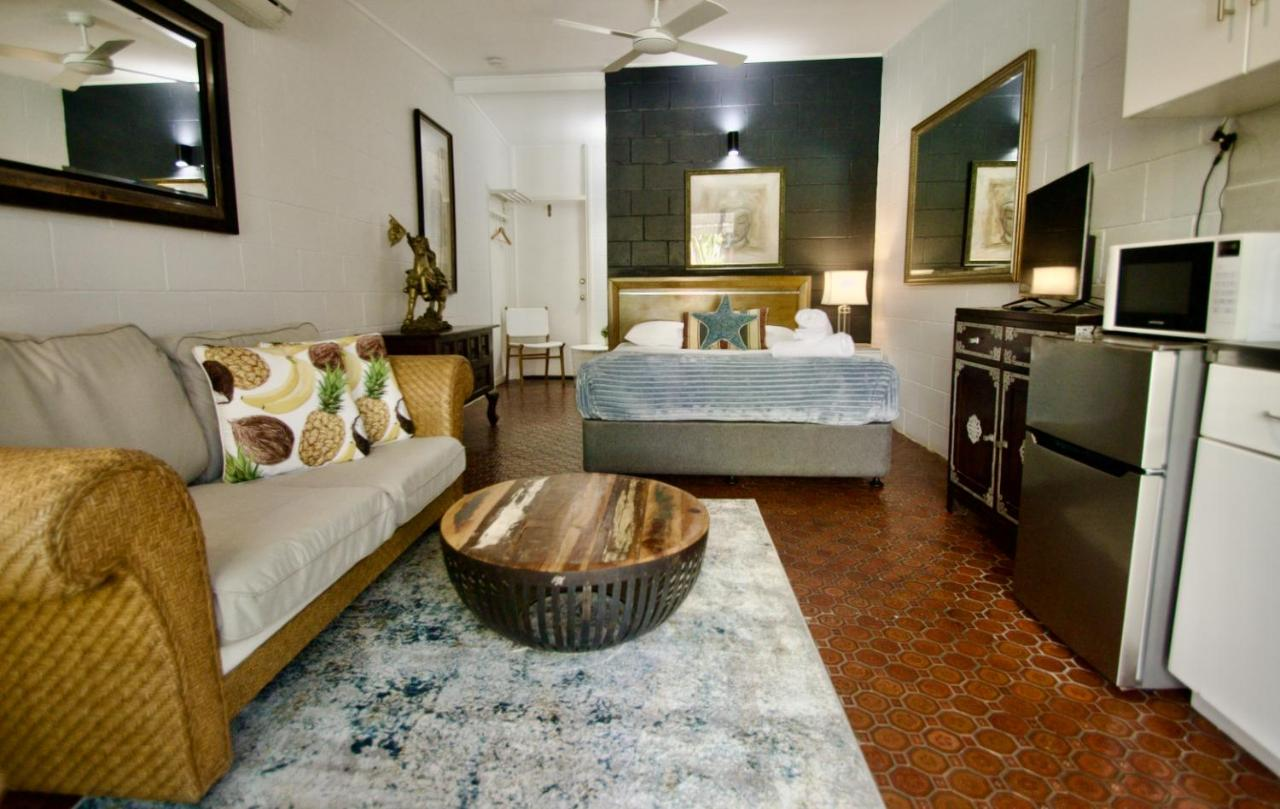 larger private suite with private sitting area couch, double bed and kitchenette Hideaway Noosa, Your Gay Men's-Only Resort on the Sunshine Coast, Australia via booking.com