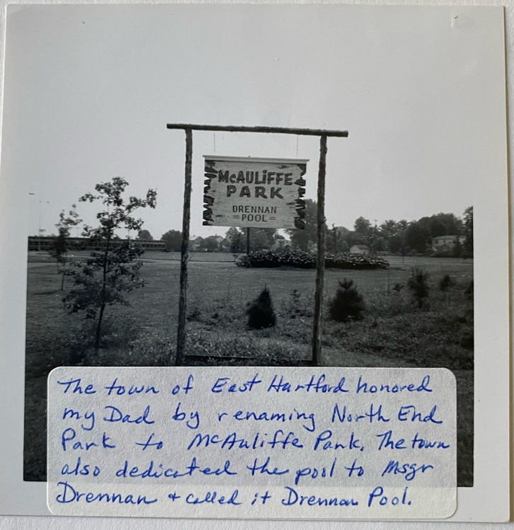 A sign on a wooden post

Description automatically generated