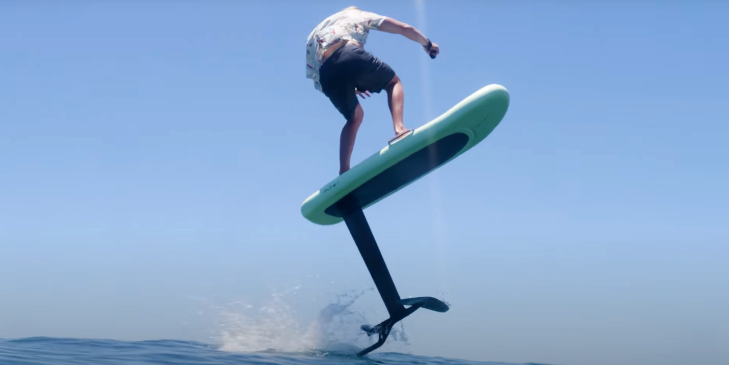 A person on a surfboard

Description automatically generated