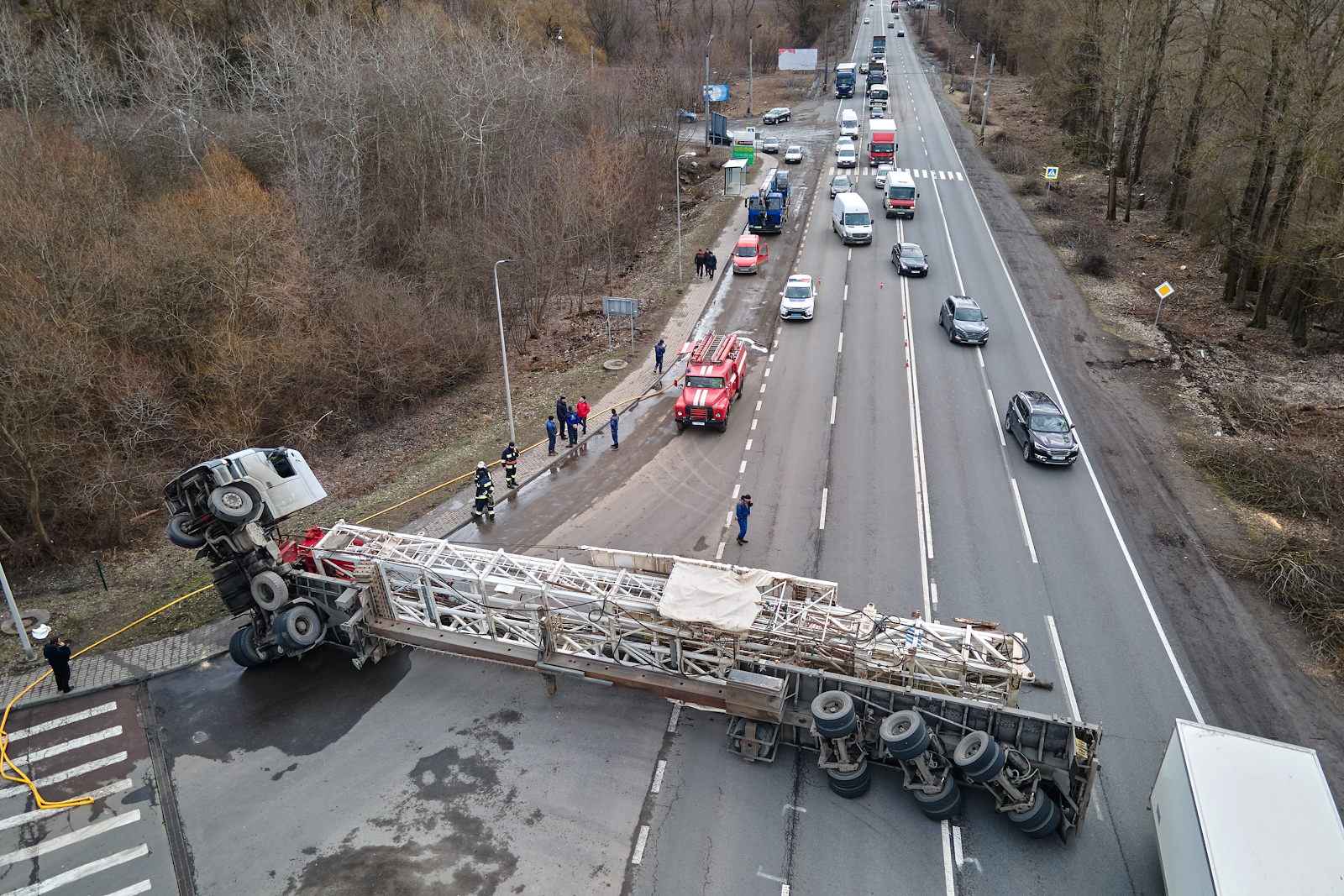 lowboy truck horrible accident on road in indiana, truck flipped over