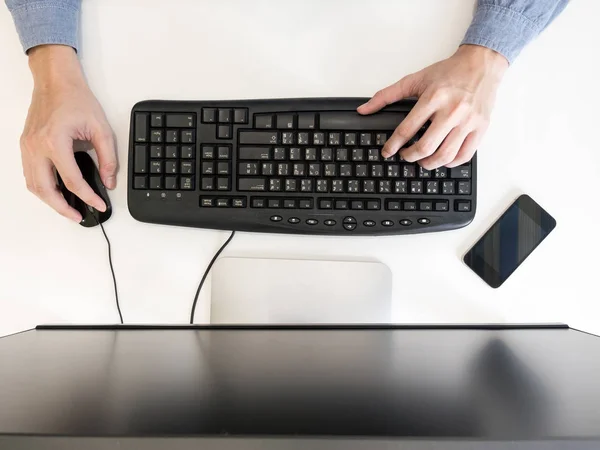 A person working on his office desk