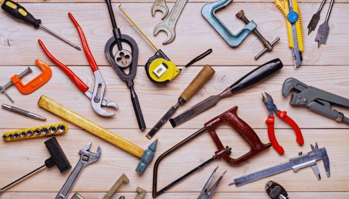 A group of tools on a wood surface

