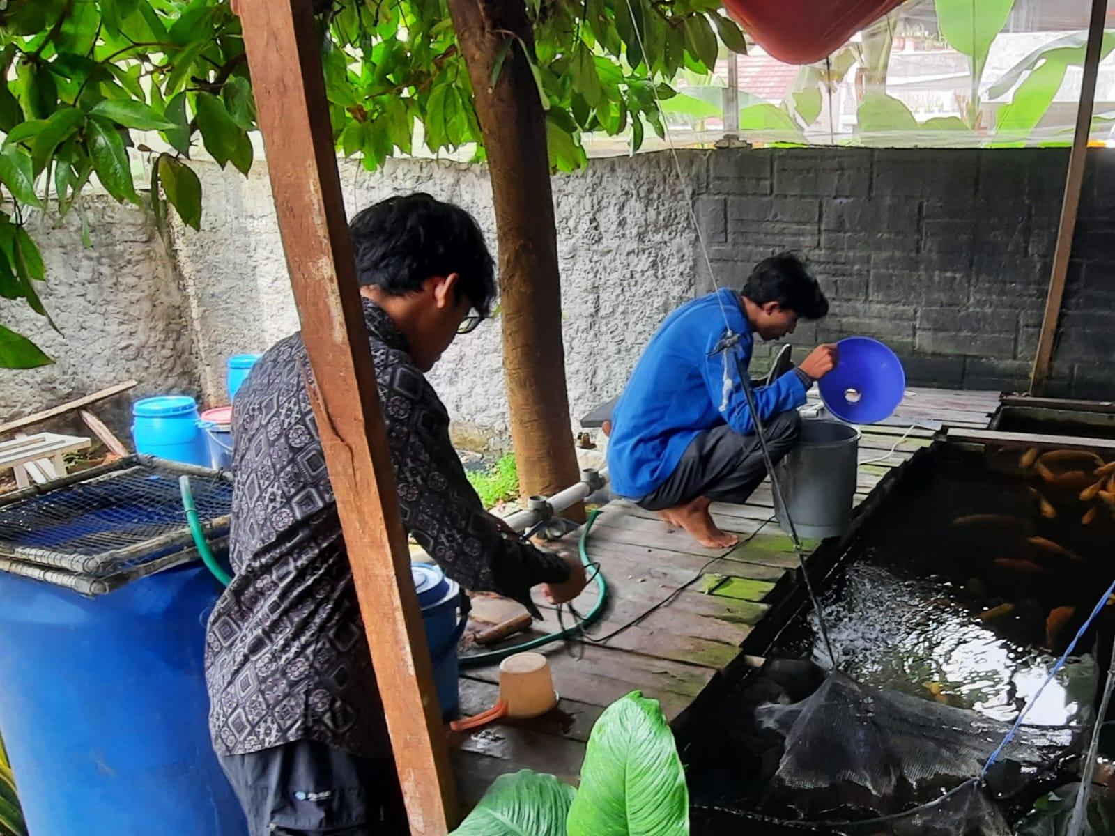 A group of men working on a pond

Description automatically generated
