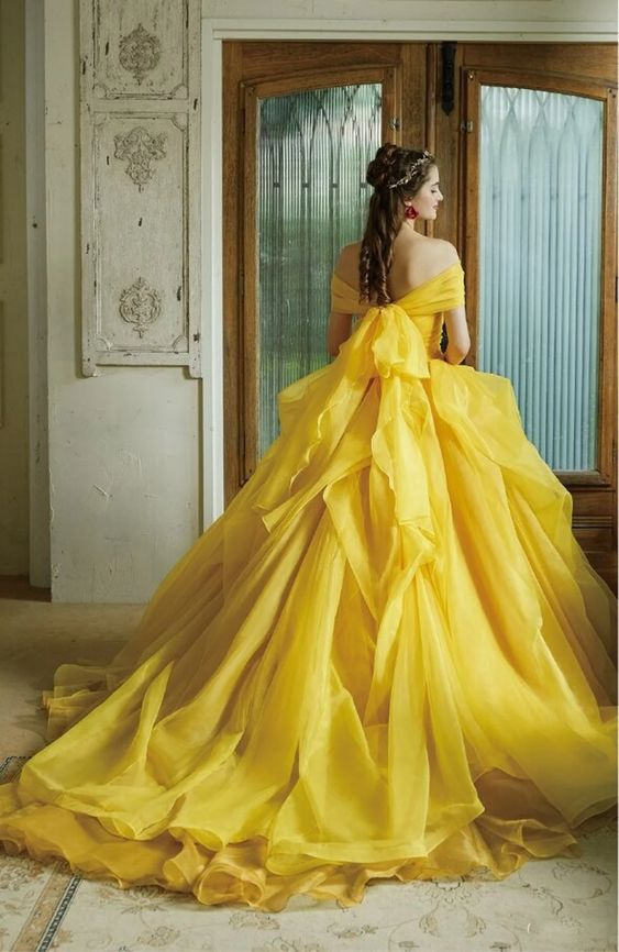Picture of a lady wearing a gorgeous ball gown with her cascading curls