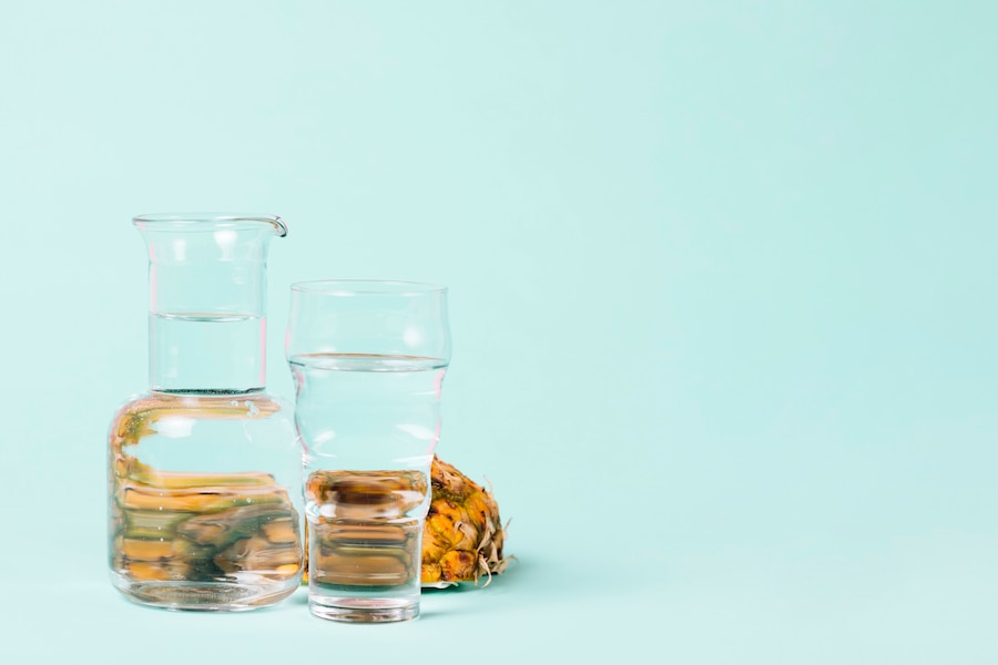 Glass pitcher and water glass with a pineapple top