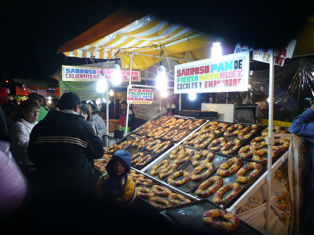 People savoring the delicious street food at Alameda Market.