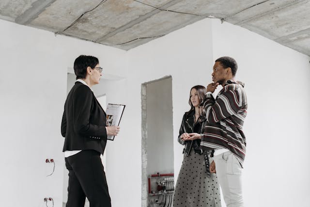 A landlord speaking with two tenants.