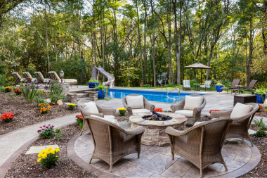 comparing patio designs for your michigan home fire pit with outdoor seating custom built okemos