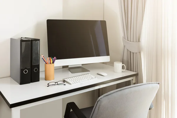 An office desk with work set up