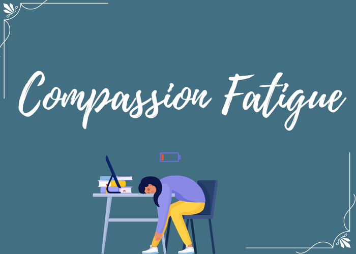 A teal image with white text that reads "Compassion Fatigue". There is a person slumped over at a desk with an empty battery above their head.