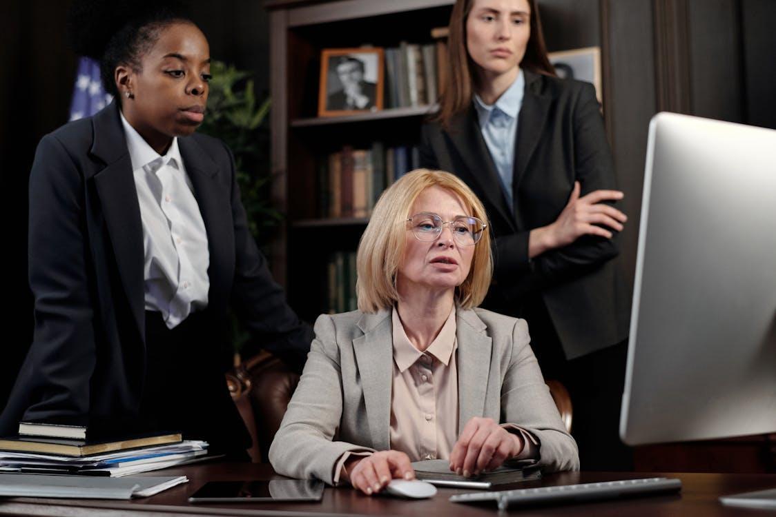 Free Businesswomen in an Office Looking at a Computer Stock Photo