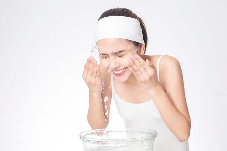 women-washing-face-before-cream-application