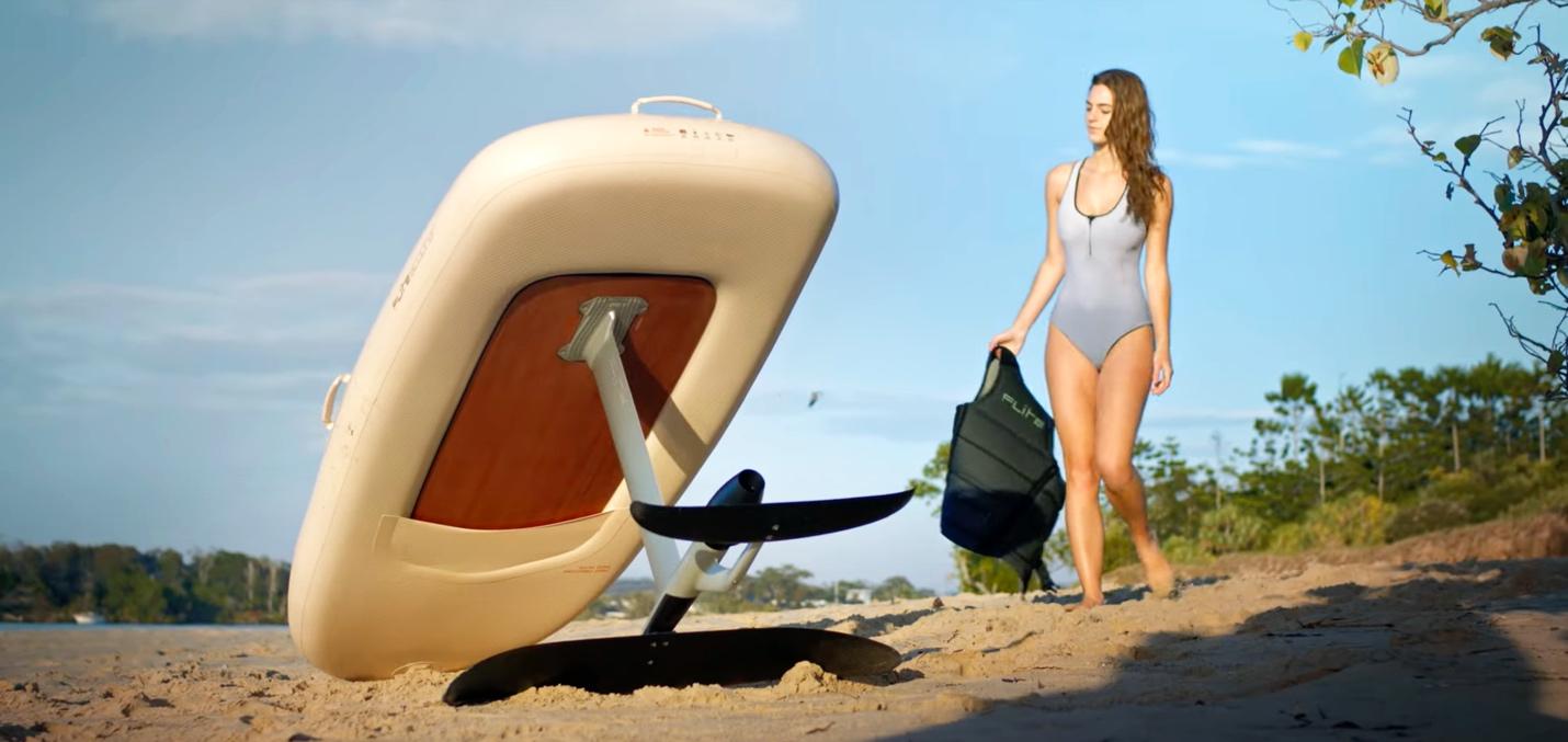 A person in a swimsuit walking next to a boat

Description automatically generated