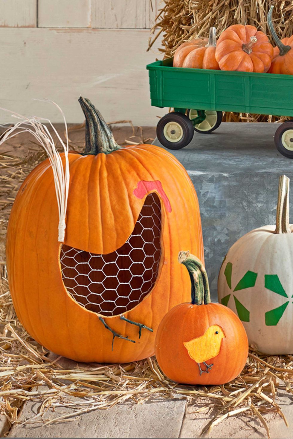 pumpkin carving ideas, two pumpkins, one small and one large carved to look like a hen and chick