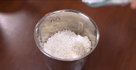 Blending soaked sabudana and rice into a smooth batter for sabudana dosa.