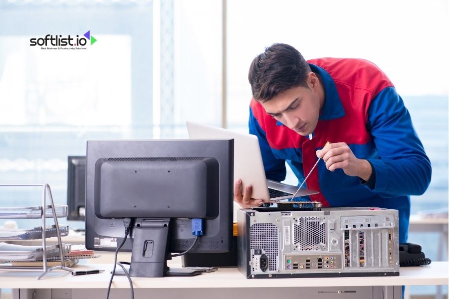 Technician working on a desktop computer with tools.