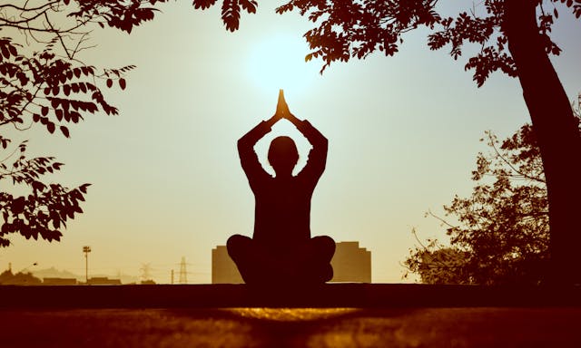 A person doing meditation exercise to improve her concentration.