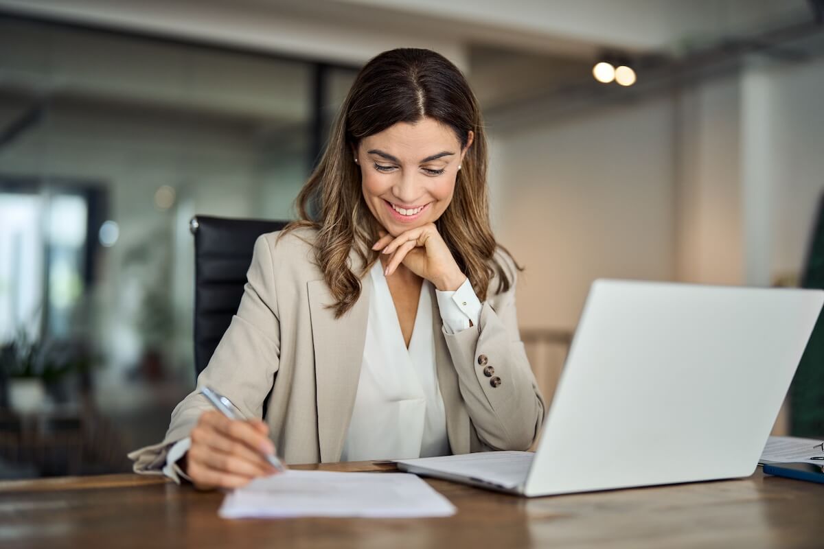 Entrepreneur writing in a notebook