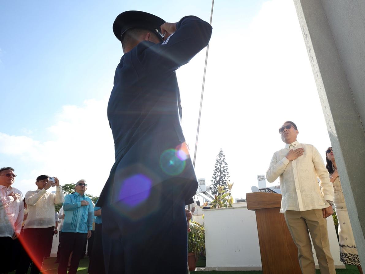 A person saluting at a podiumDescription automatically generated