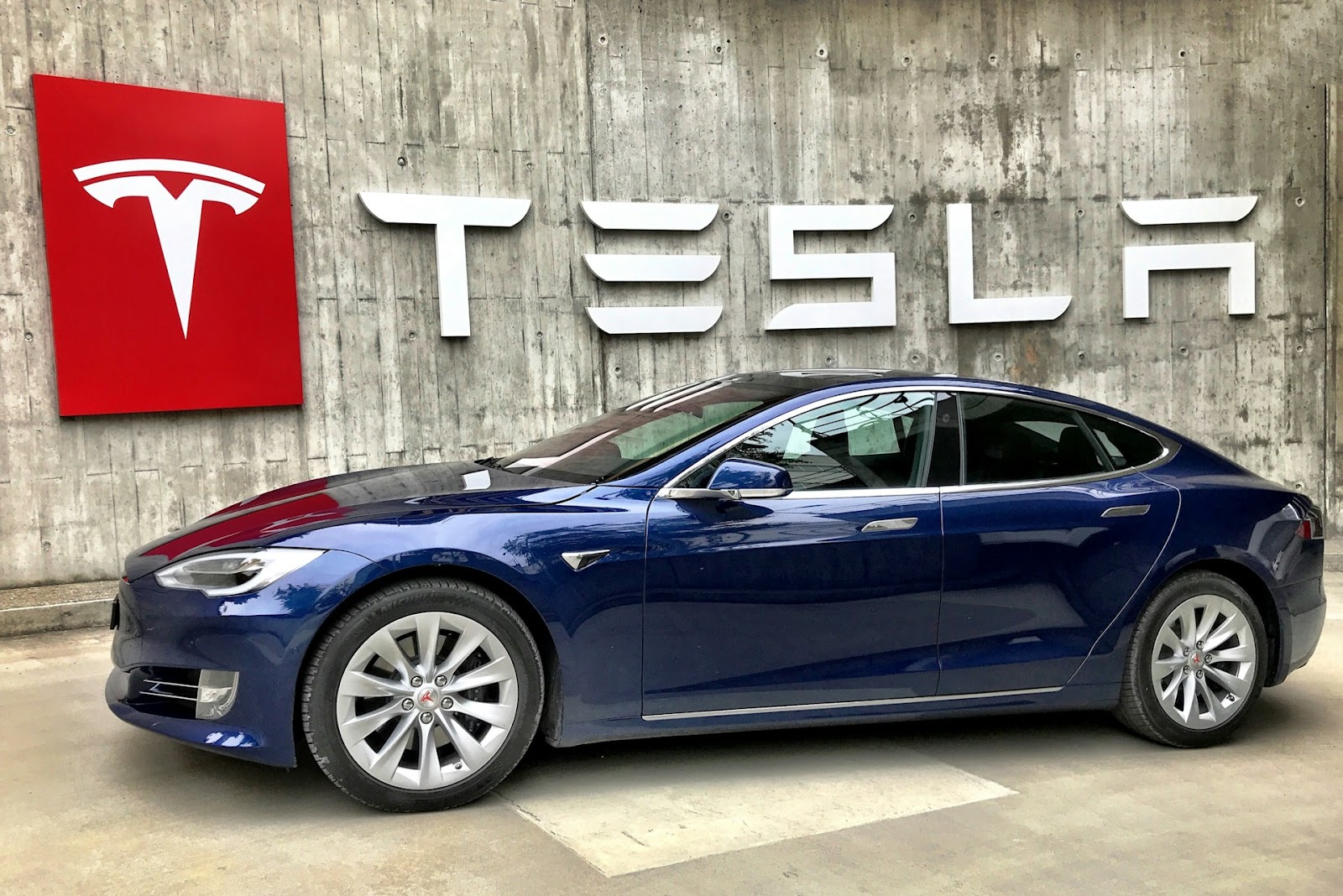 A Tesla Model electric car parked on a street