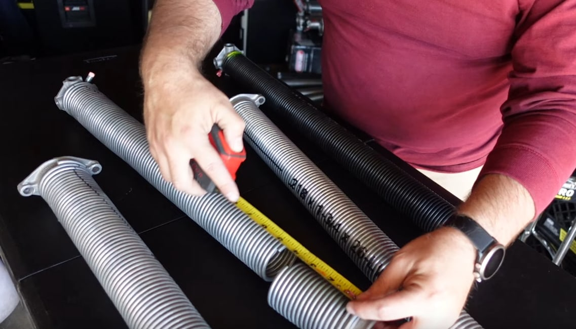 how to change garage door spring