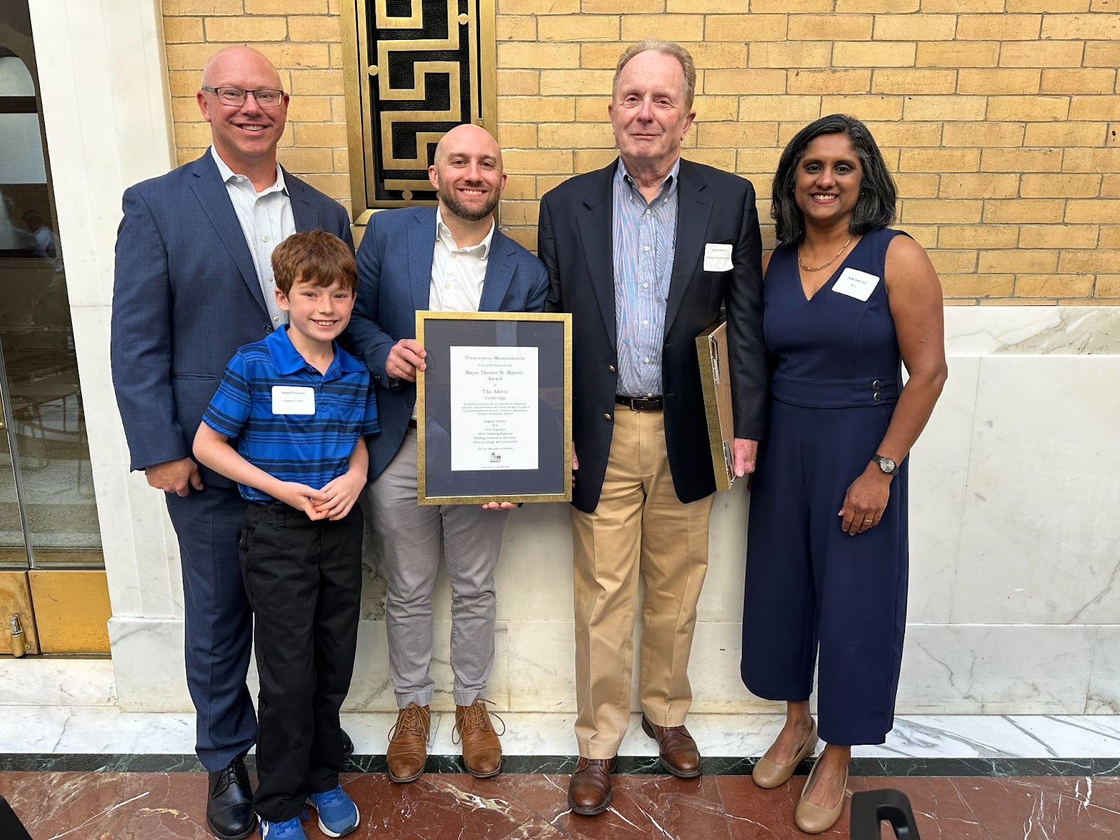 Historic association and Regency Centers team members pose with framed Lifetime of Preservation award