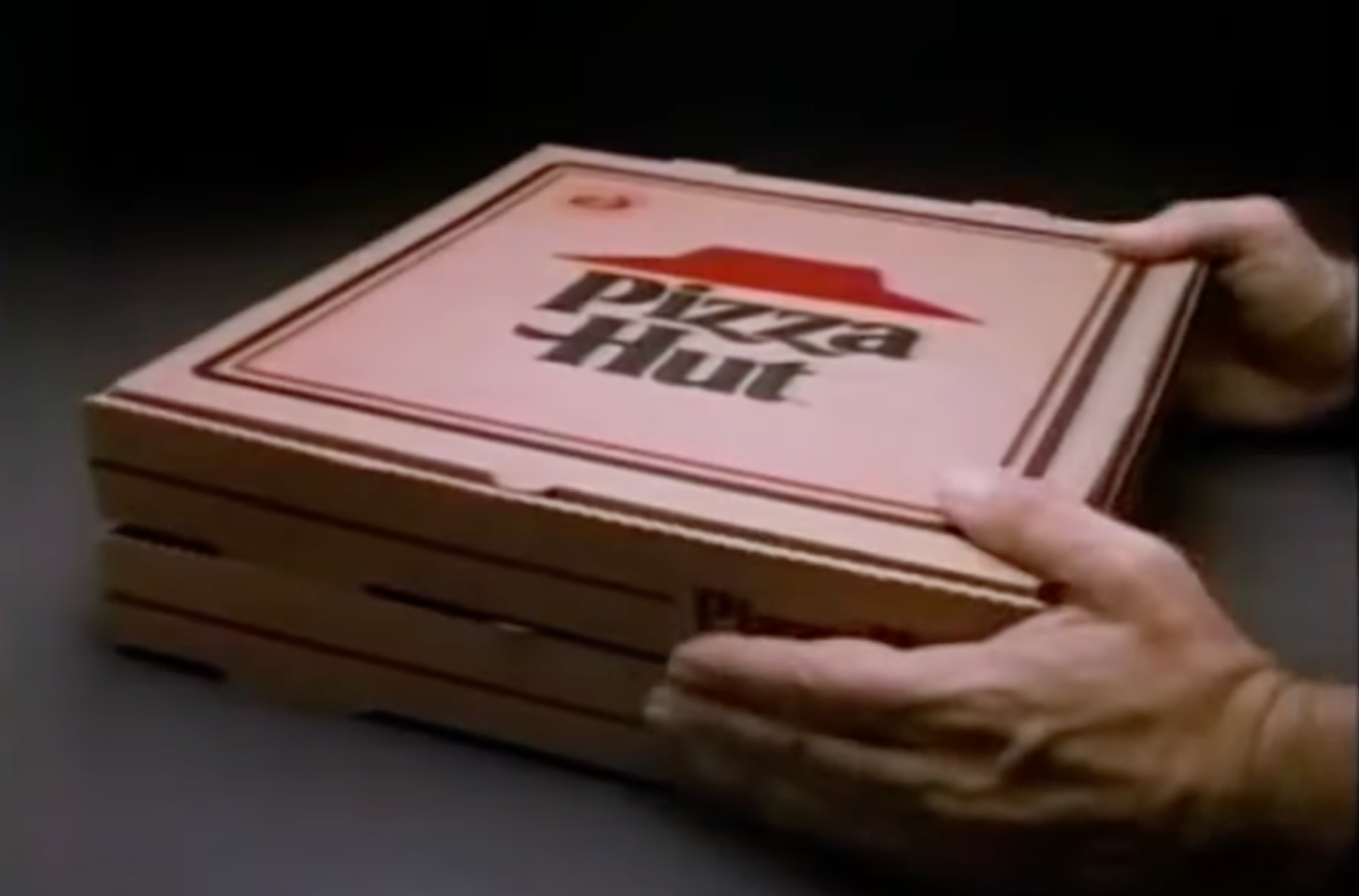 a stack of Pizza Hut boxes