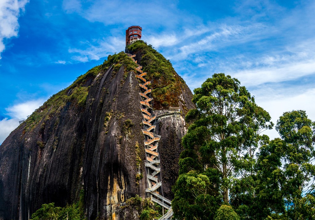 A stunning view of El  Peñón, surrounded by lush greenery.