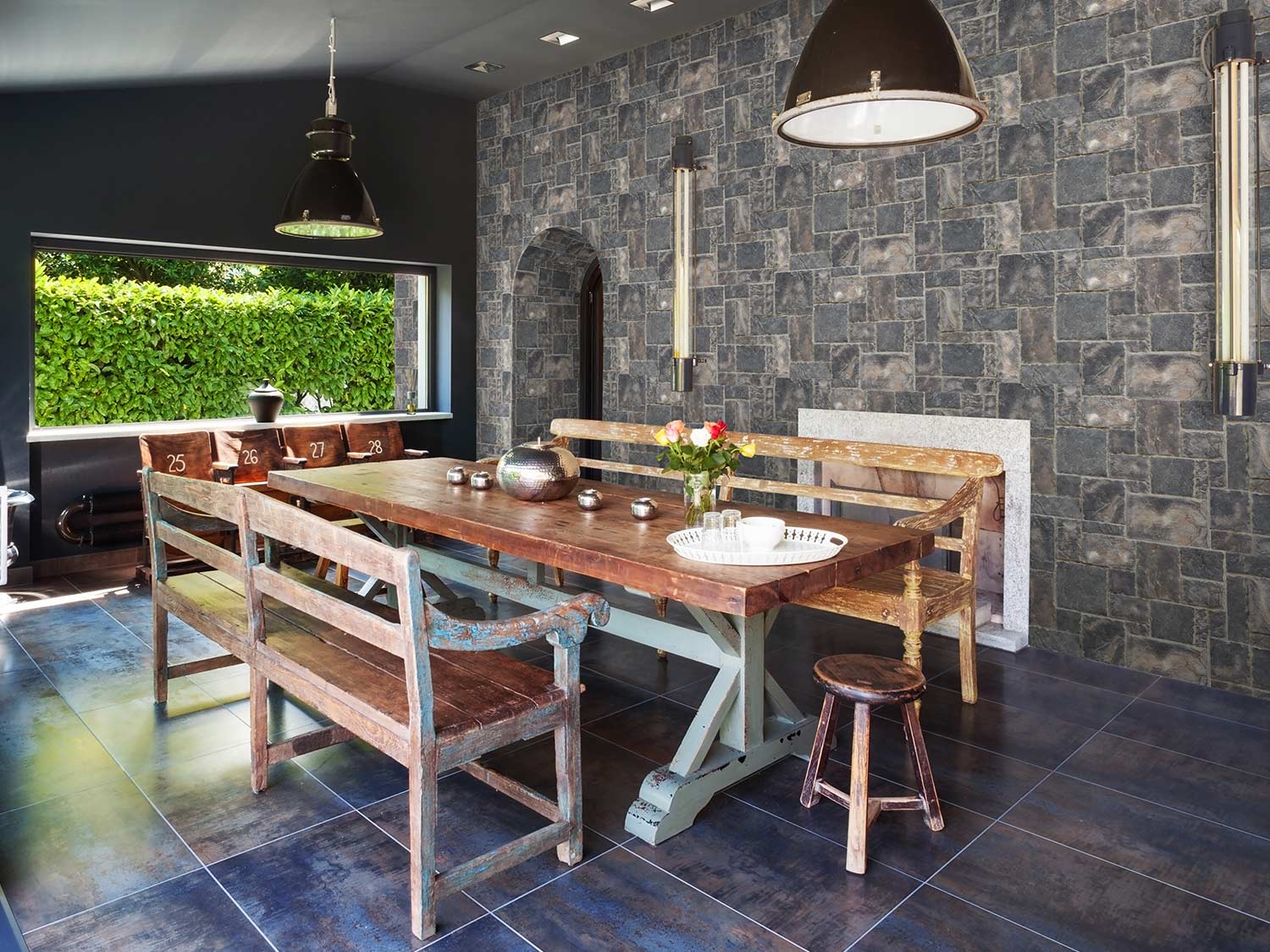 Carolina Chiseled Faux Stone Wall Panel in Mist as a back patio dining backdrop