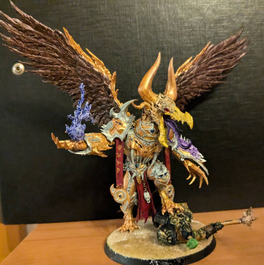 A statue of a warrior with wings Description automatically generated