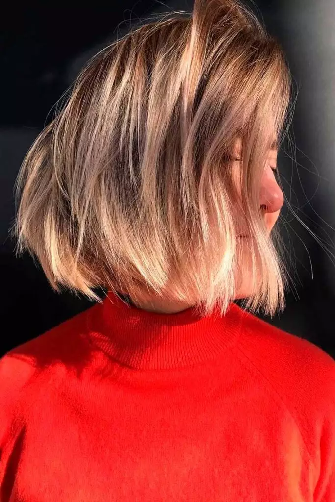 Side view of  a lady wearing the gorgeous   hairstyle