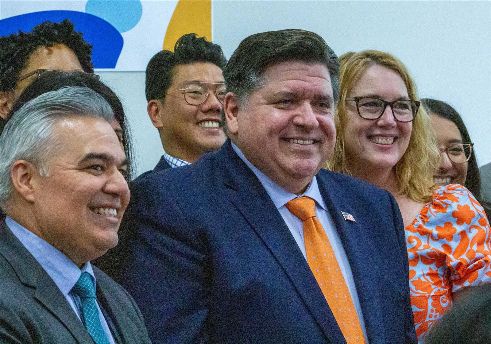Gov. JB Pritzker poses for photos with early childhood advocates 