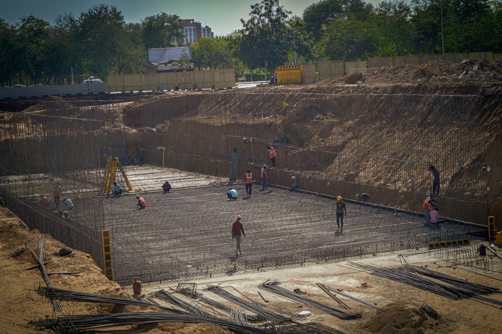  Workers installing rebar at a large civil construction site.