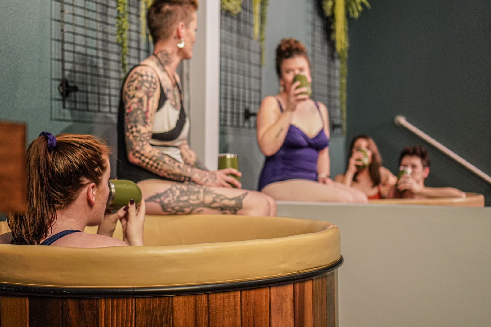Five people having a spa party in Denver at Oakwell Beer Spa