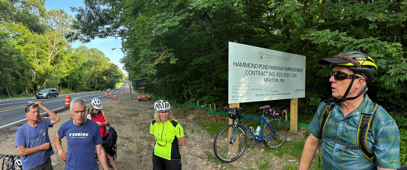 The DCR’s Dan Driscoll describes the reconstruction of Hammond Pond Parkway, now underway. A paved path will be in the strip behind the people listening. 