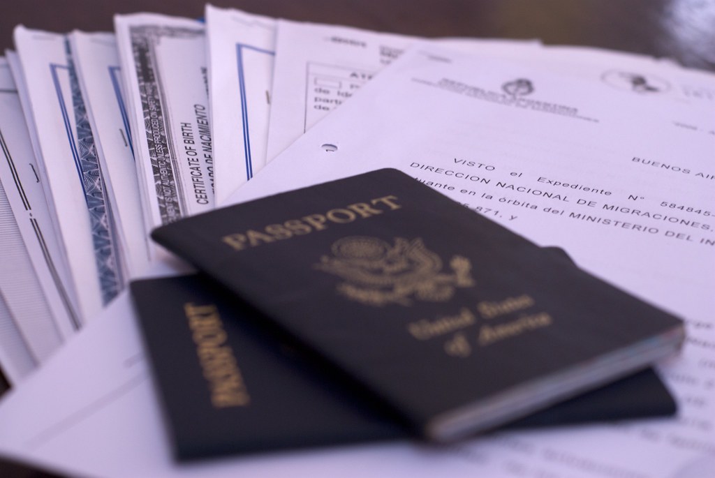 A picture showing passport and other documents underlying.