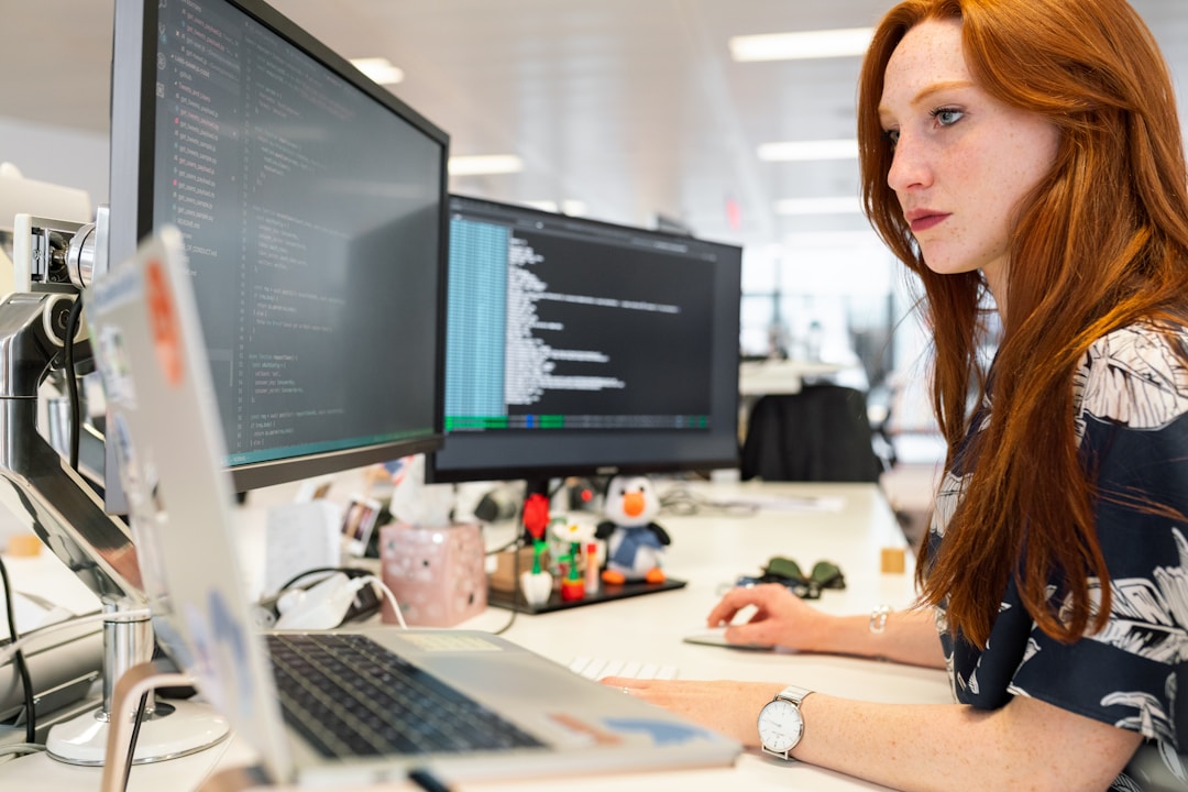  A woman in an office researching sales bookings on her computer