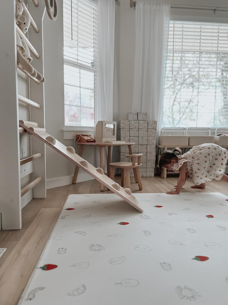 Baby Play Mat: Image showing a little girl playing in a clean organized house with a play mat that is clutter free. Clear of mold or Mildew resistance. 