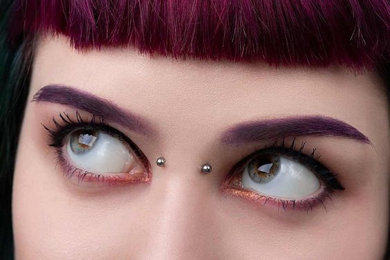 Picture of a lady wearing the edgy bridge piercing