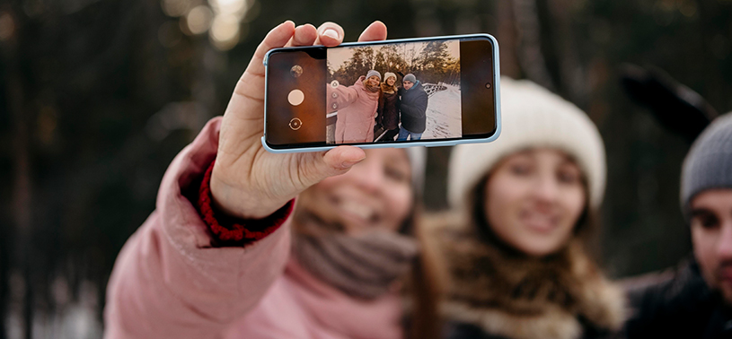 group of friends taking pics on friendship day