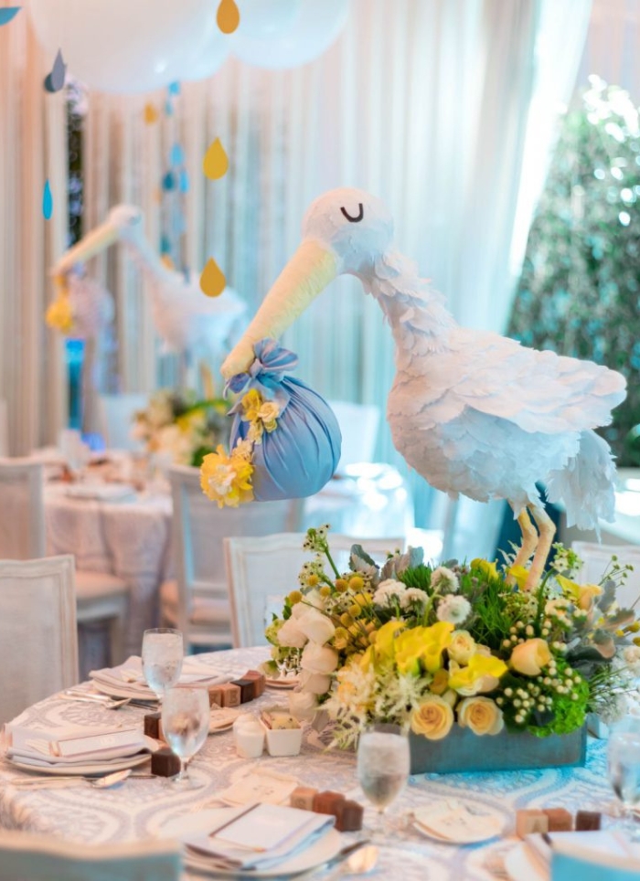 stork centerpiece on table for baby shower