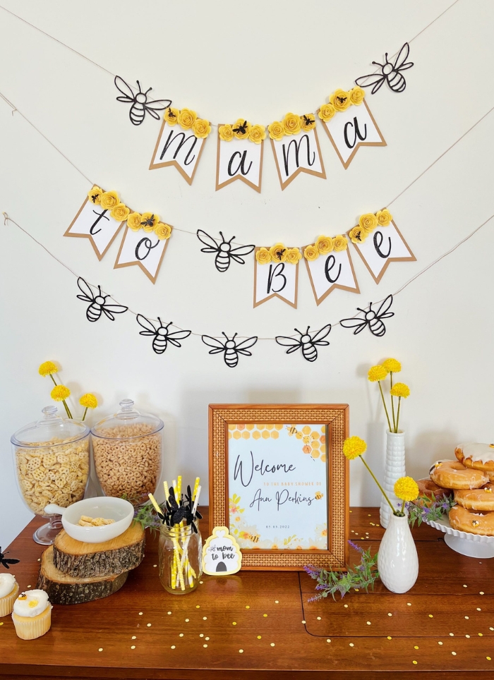 mama to bee sign hanging over food table