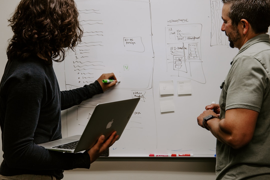 A team plans their competitive advantages on a whiteboard