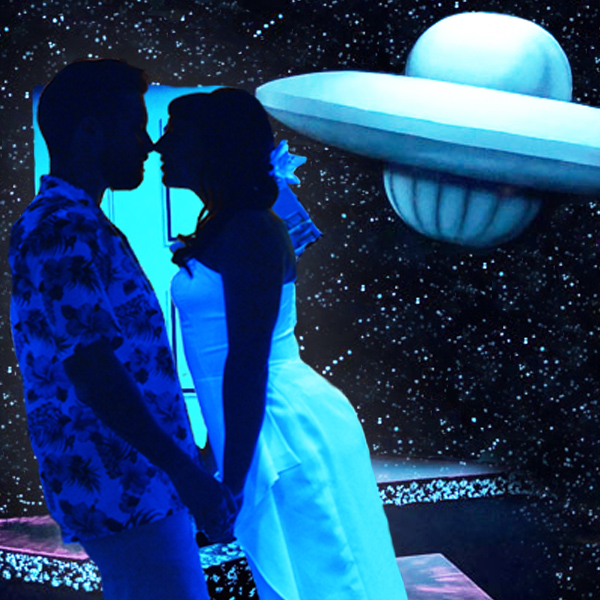 Two people getting married with a sci-fi backdrop. 