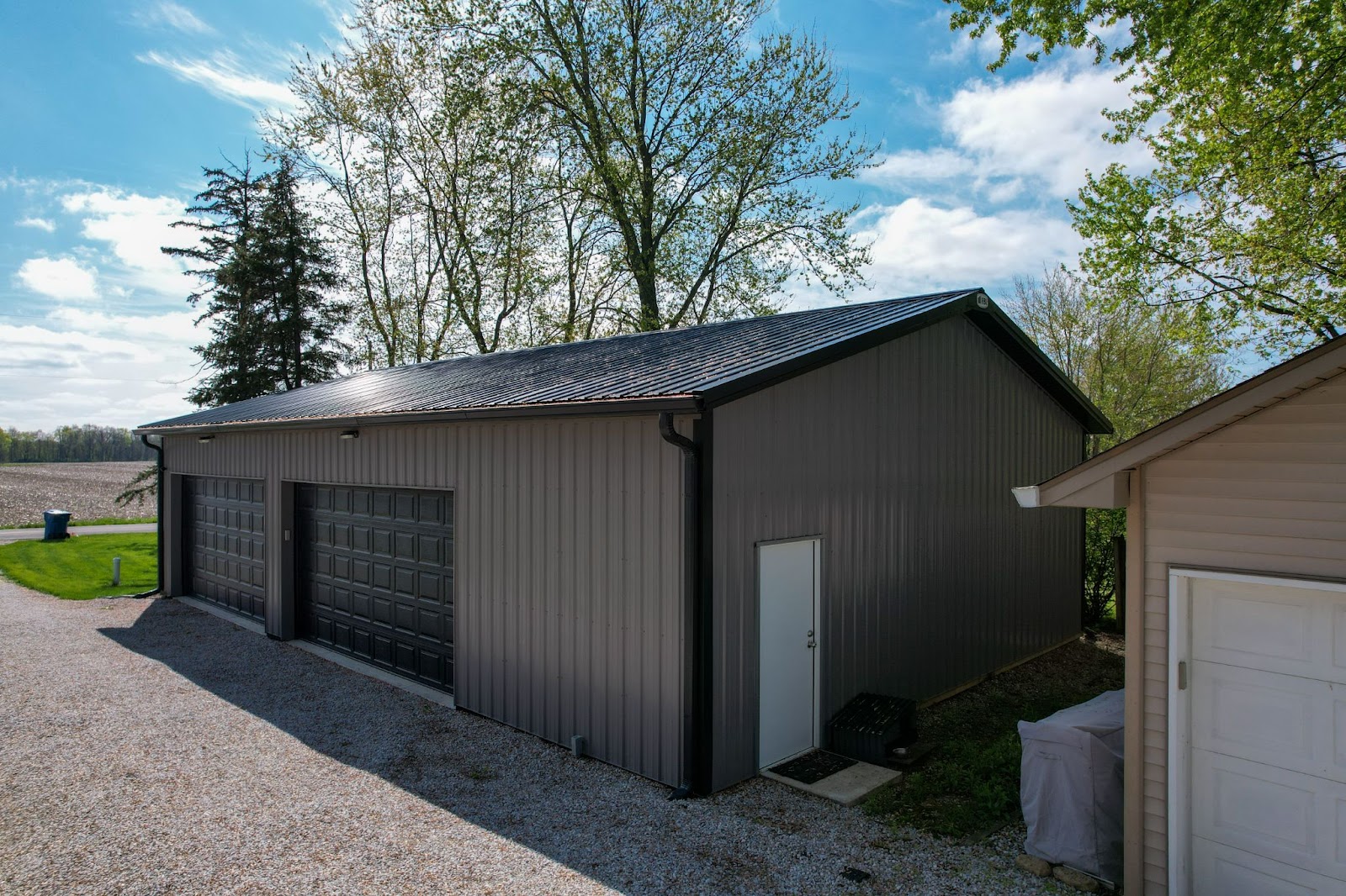 Dark 2 car pole barn garage