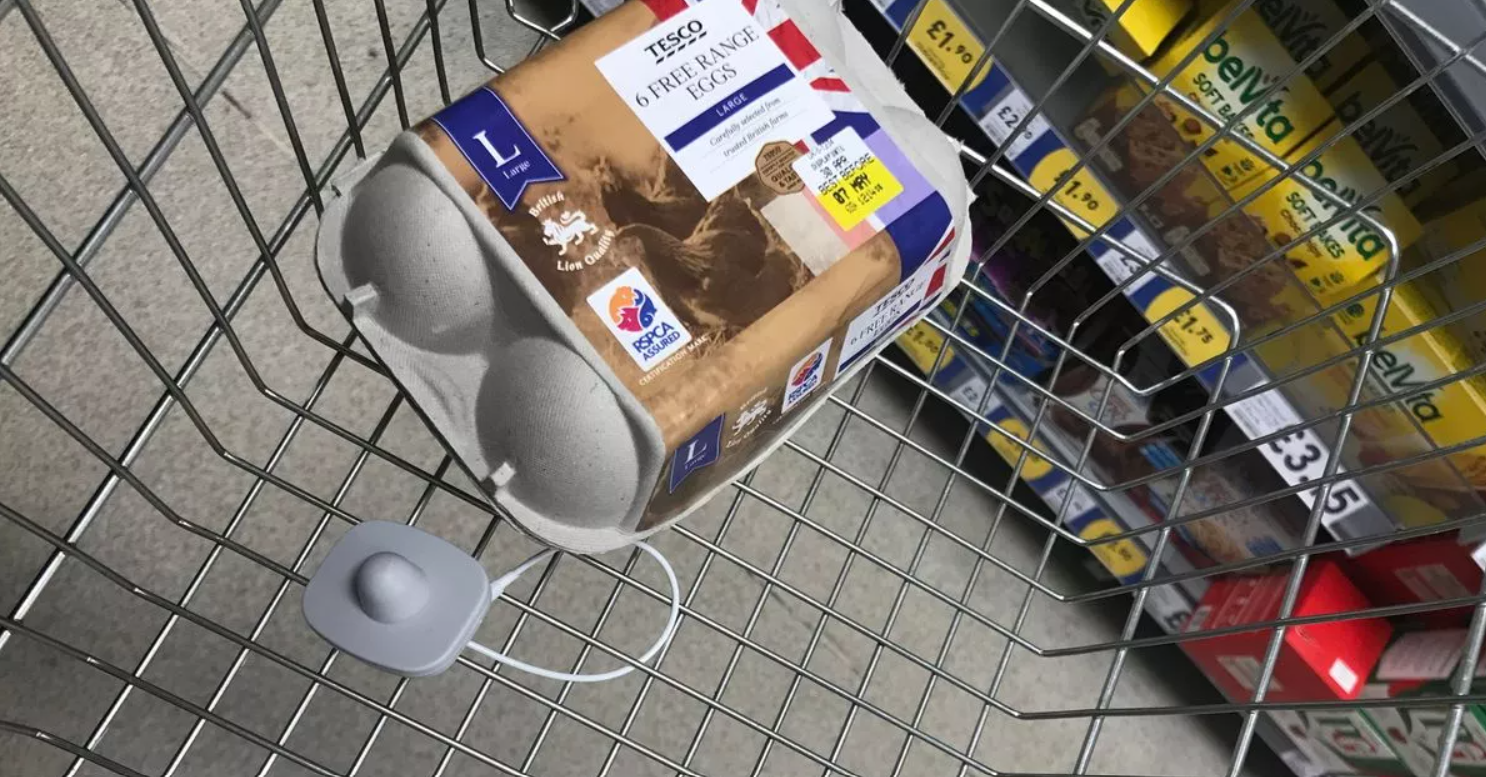 A carton of eggs on a shopping cart

Description automatically generated