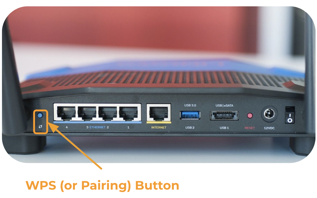 The back side of a router with an arrow pointing to the WPS (or Pairing) button.