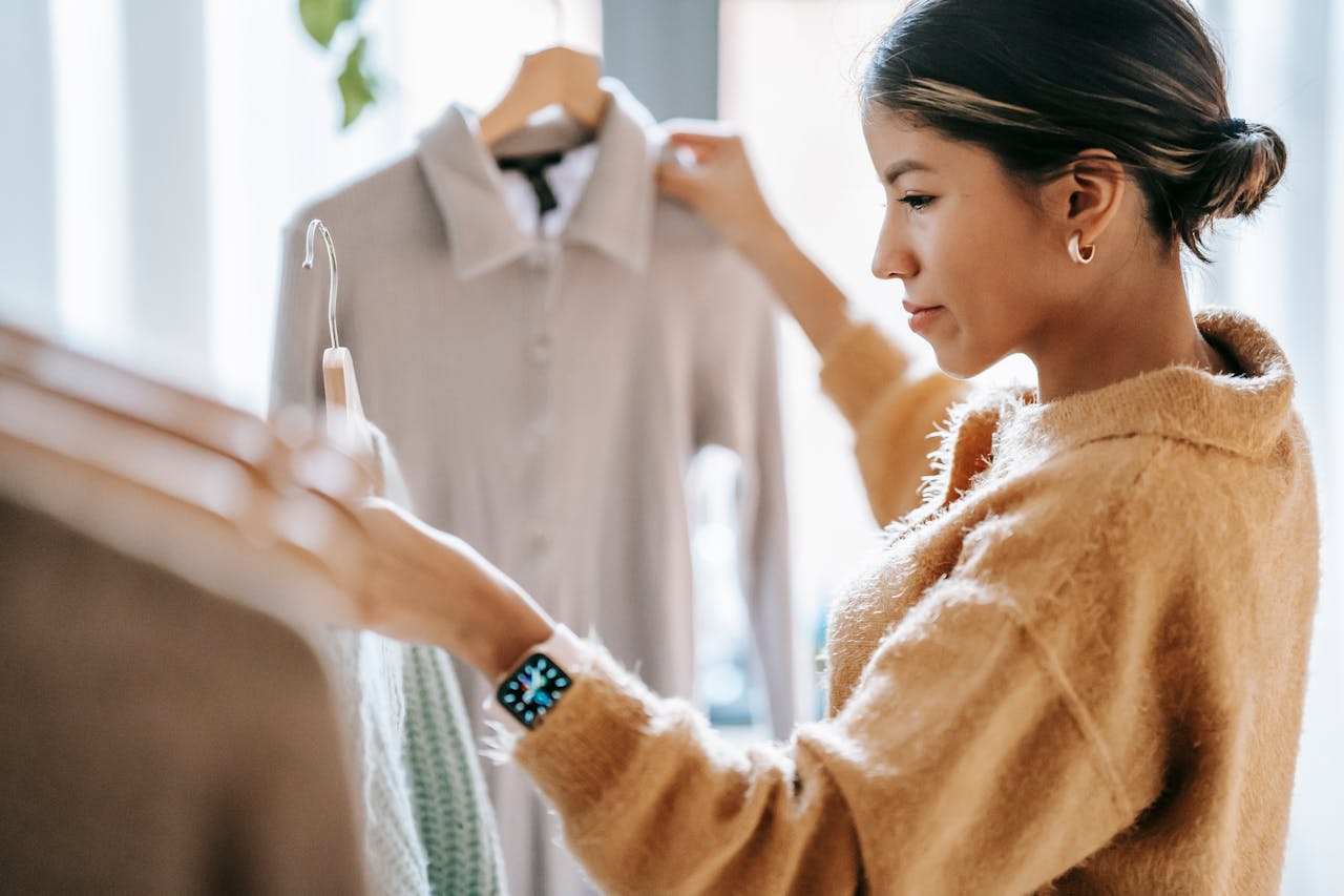 A lady choosing her outfit.